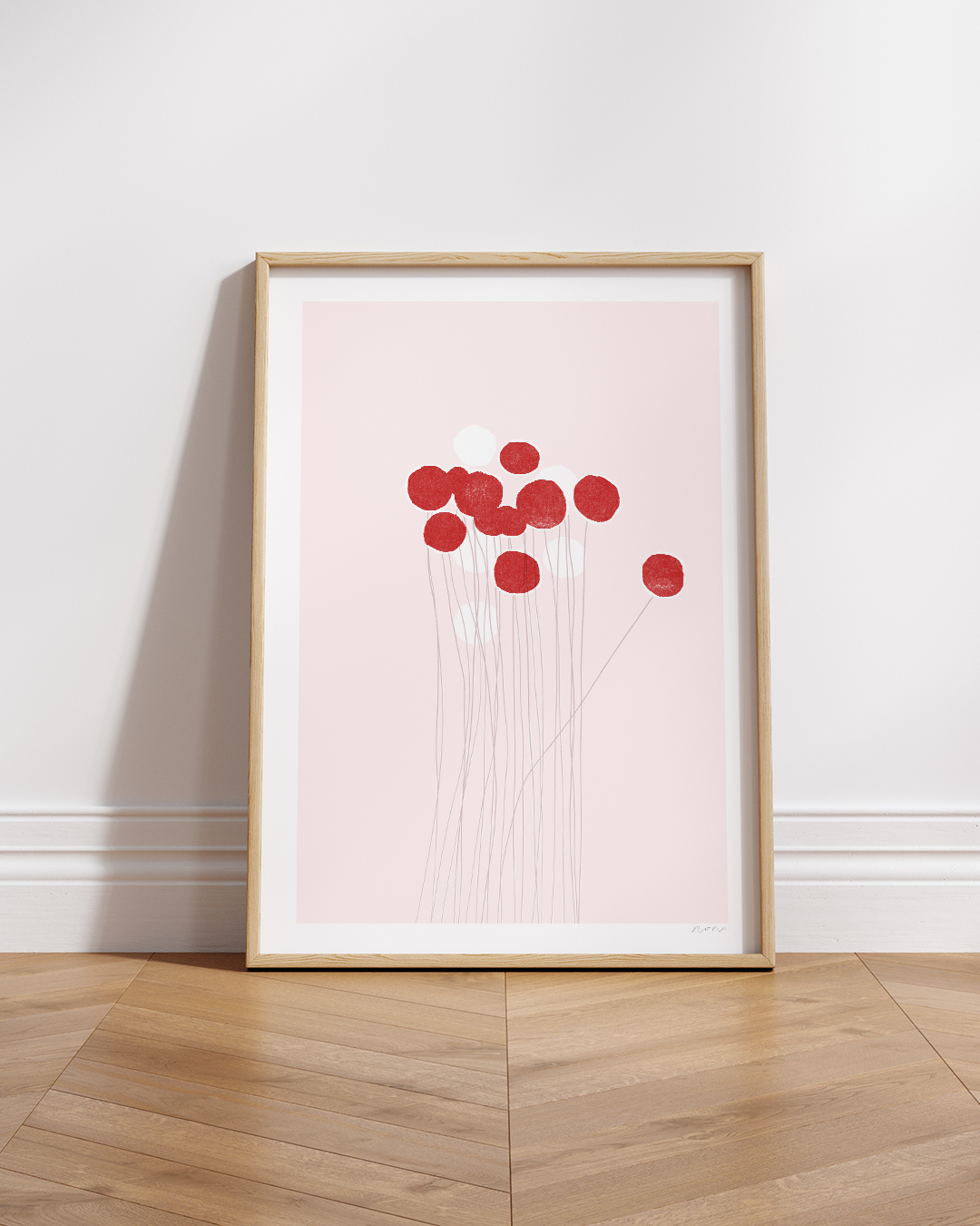 Red Pom-Pom Art Print in white frame, styled on a timber ledge