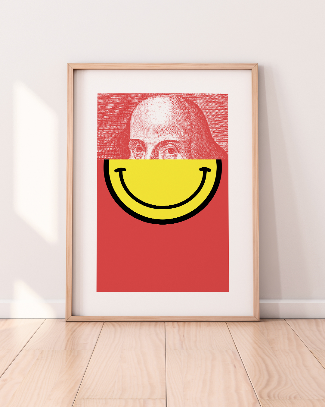 Framed Bard print in daylight on a timber floor with red background