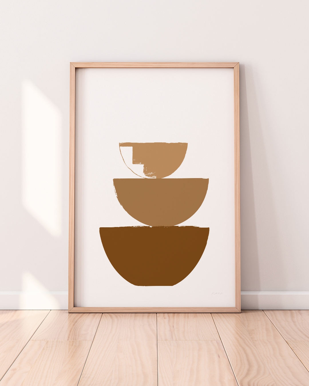 Framed brown Bowls Art Print with afternoon light casting across floor